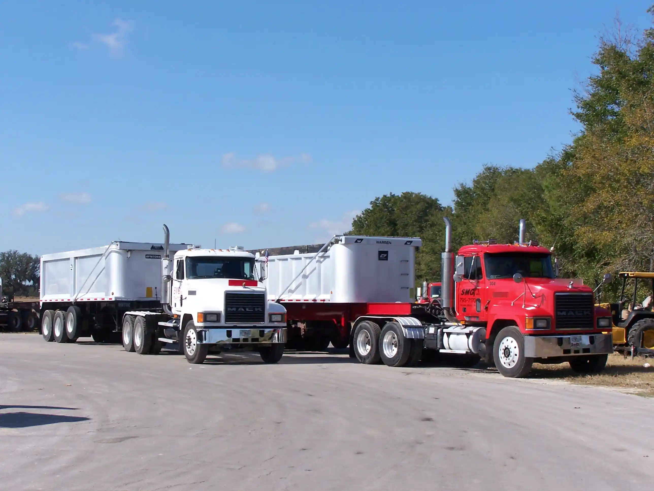 Two Class A 25 yards truck and trailers.